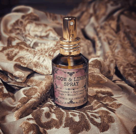 Room & Linen Spray bottle on vintage fabric, featuring lavender and vetiver scent, perfect for vintage home decor.