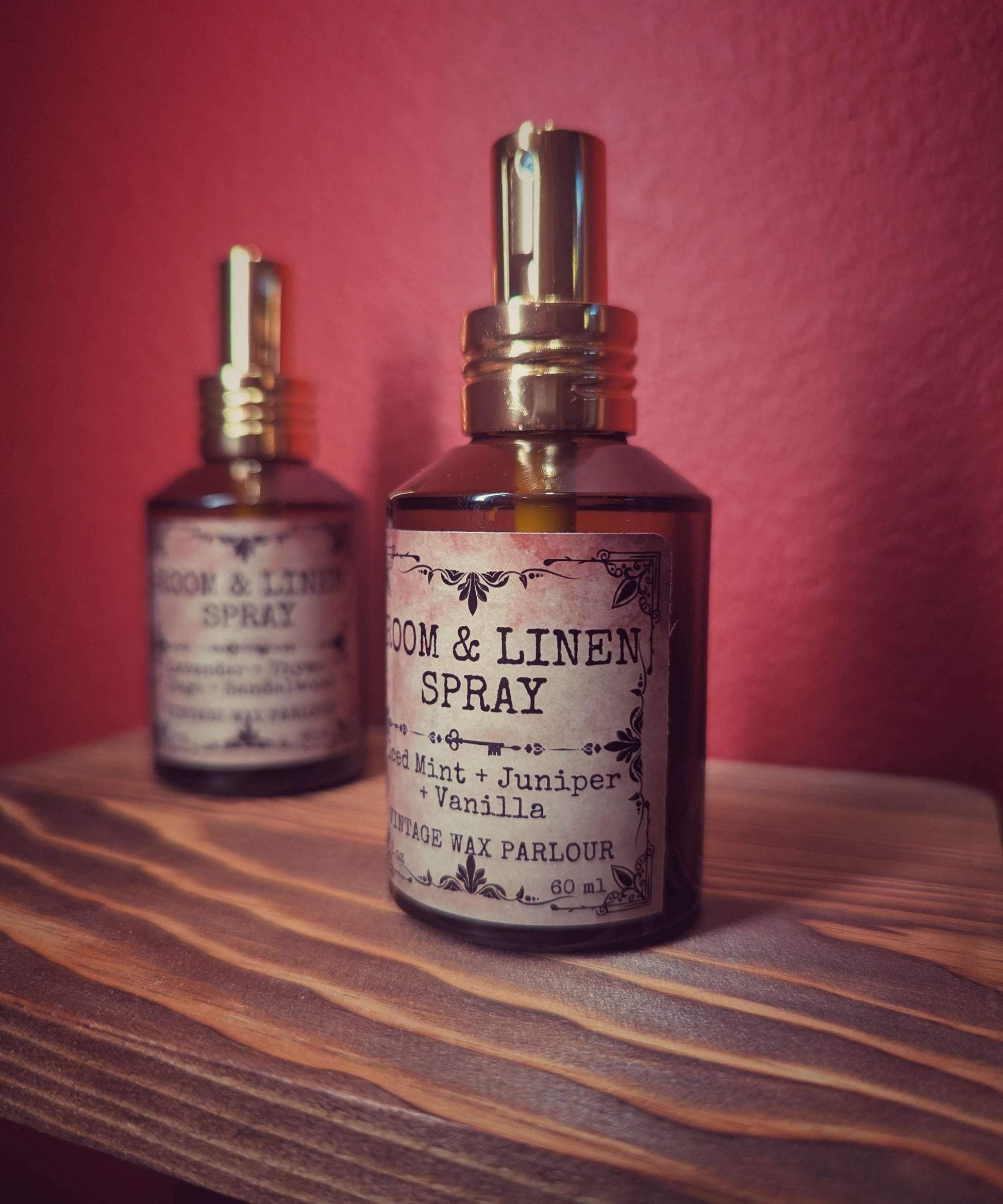Room & Linen Spray bottles in vintage packaging on a wooden shelf, perfect for vintage home decor and fresh scents.